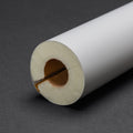Close-up of K-Flex PU Pipe Insulation with a white exterior and brown interior on a dark grey background